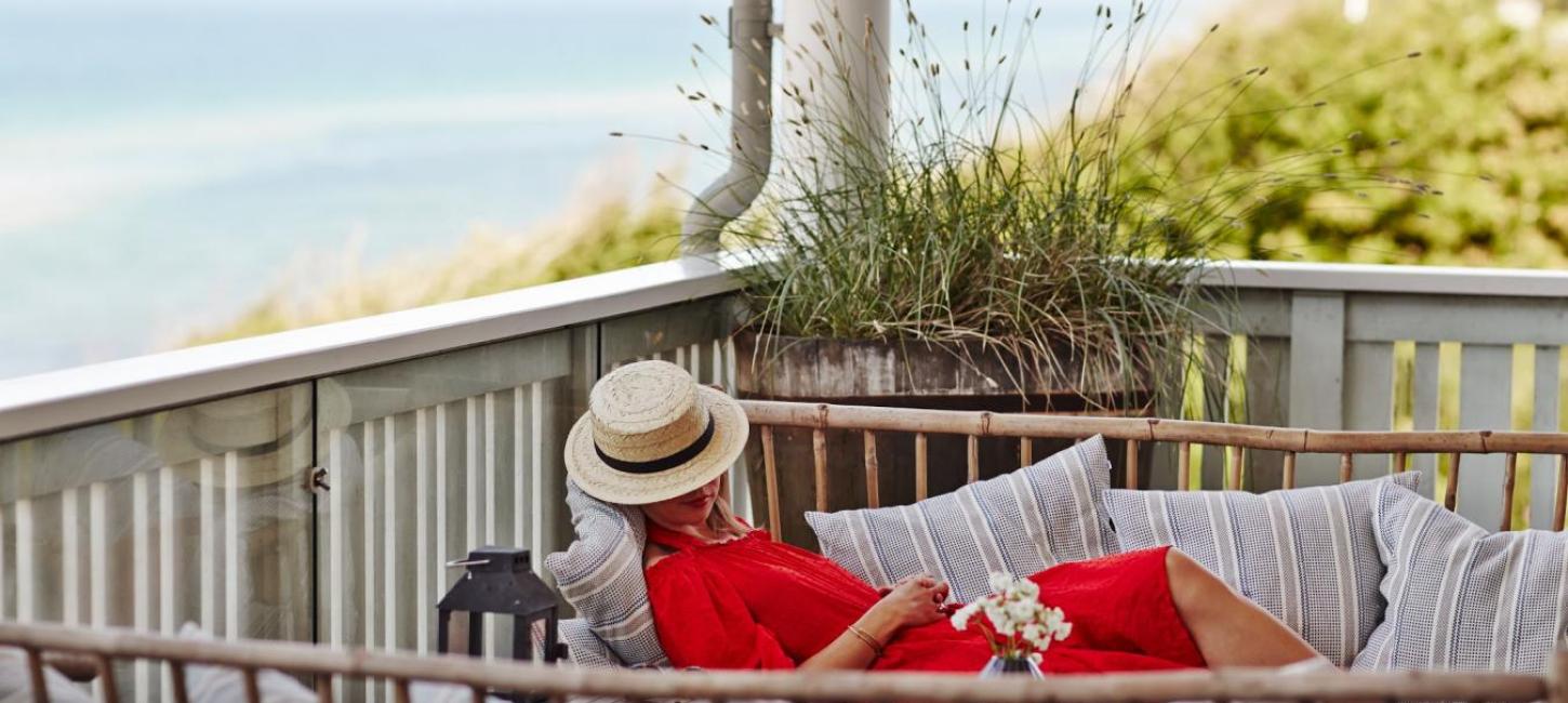 A woman relaxes at the luxury beach hotel Helenekilde Badehotel in North Zealand, Denmark