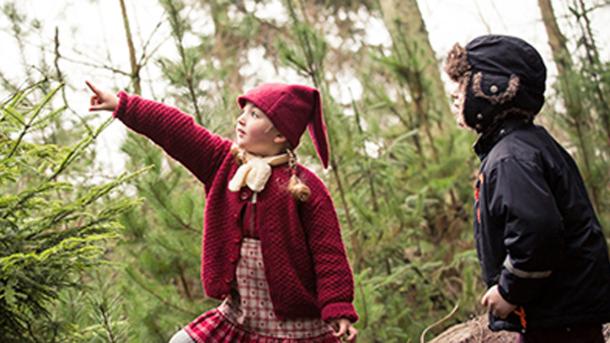 A child dressed as a christmas elf